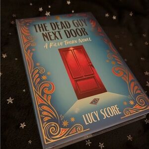 The Dead Guy Next Door by Lucy Score - Red and Blue Cover